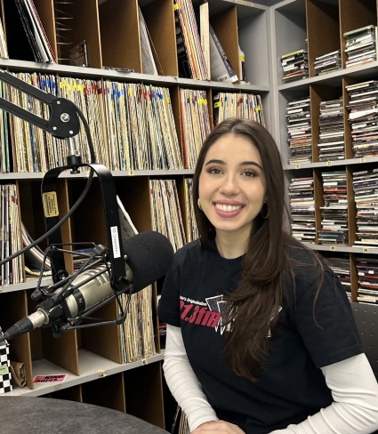 Alessia at microphone smiling 