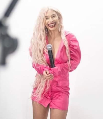 Photo Of Talia Rodriguez holding a microphone